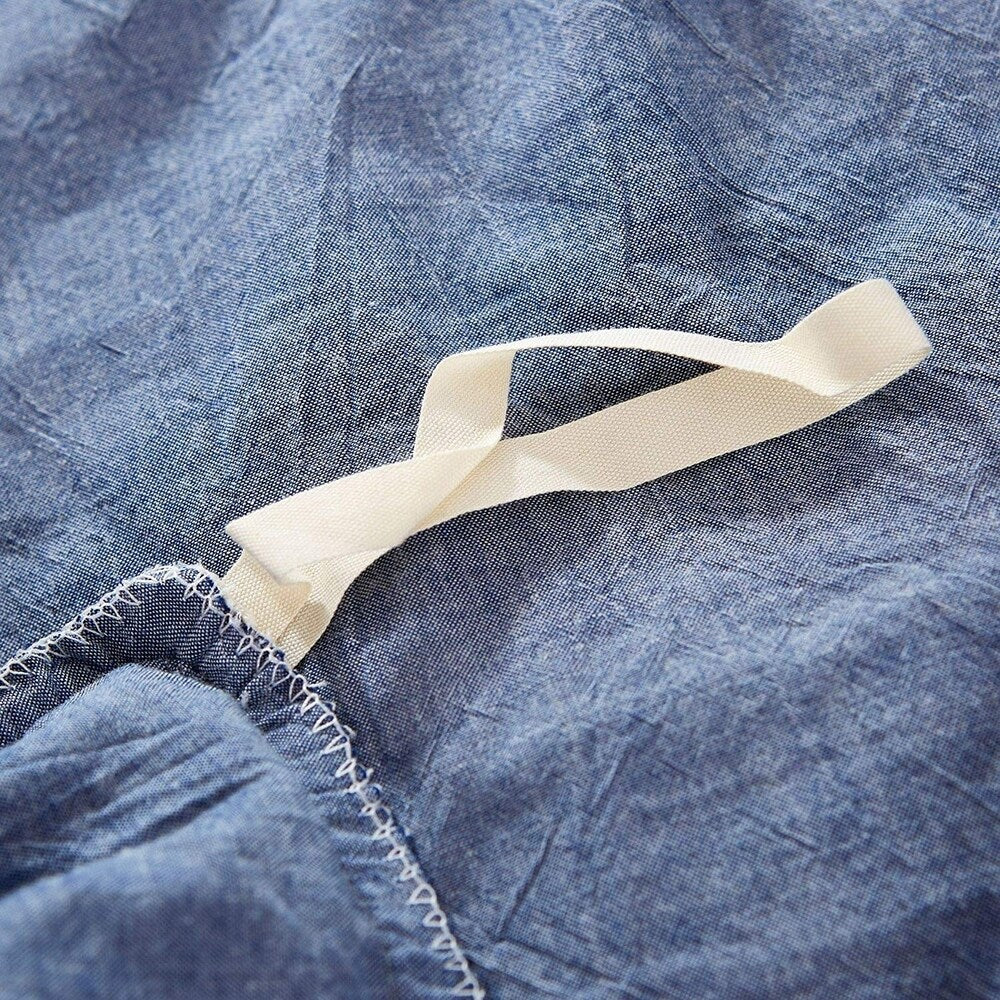 Parure de lit réversible en coton à pompons