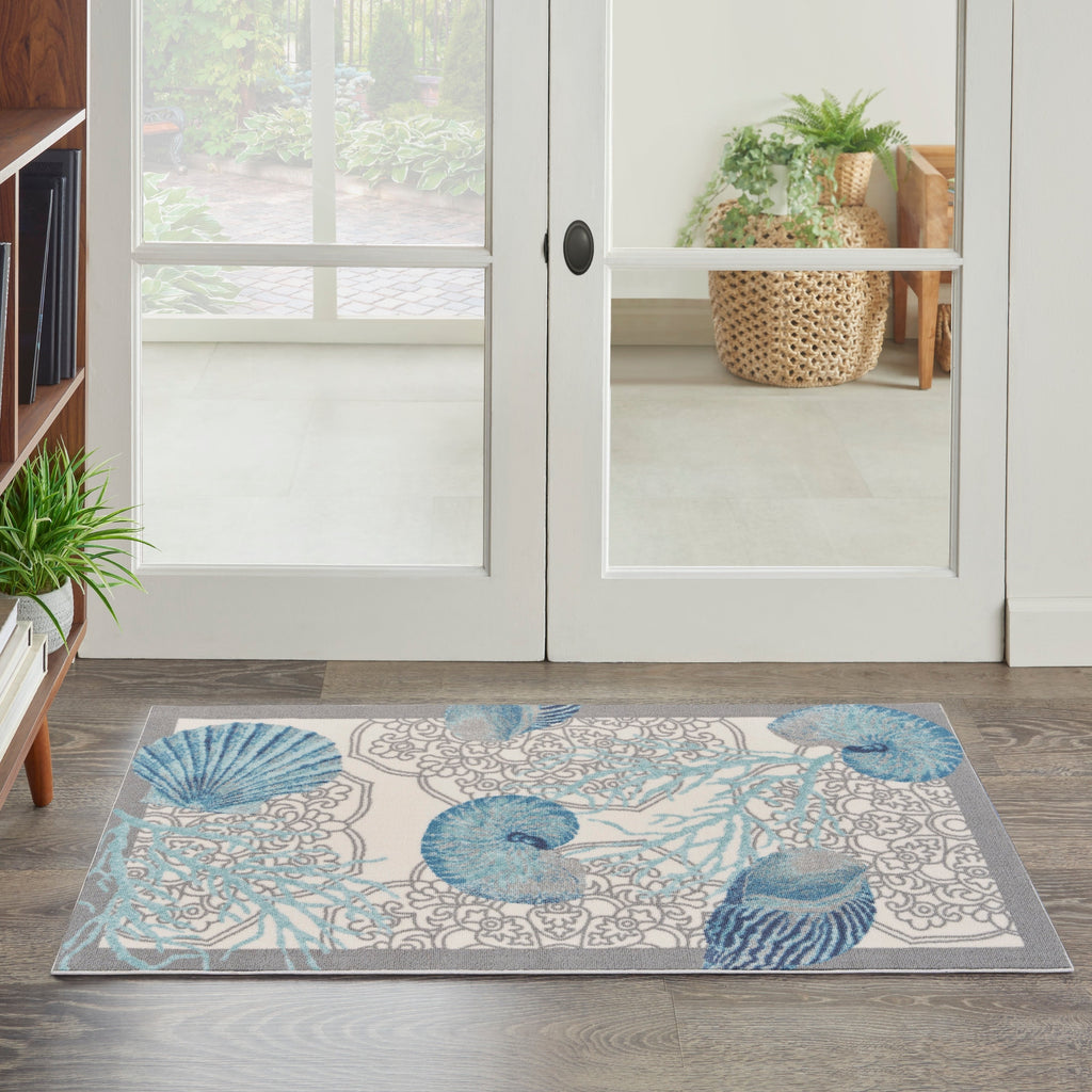 Tapis d'intérieur et d'extérieur Waverly Sun &amp; Shade Shore Thing à motif de coquillages tropicaux et floraux
