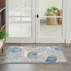 Tapis d'intérieur et d'extérieur Waverly Sun &amp; Shade Shore Thing à motif de coquillages tropicaux et floraux