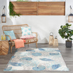 Tapis d'intérieur et d'extérieur Waverly Sun &amp; Shade Shore Thing à motif de coquillages tropicaux et floraux