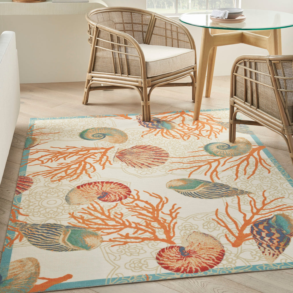 Tapis d'intérieur et d'extérieur Waverly Sun &amp; Shade Shore Thing à motif de coquillages tropicaux et floraux