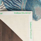 Tapis d'intérieur et d'extérieur Waverly Sun &amp; Shade Shore Thing à motif de coquillages tropicaux et floraux